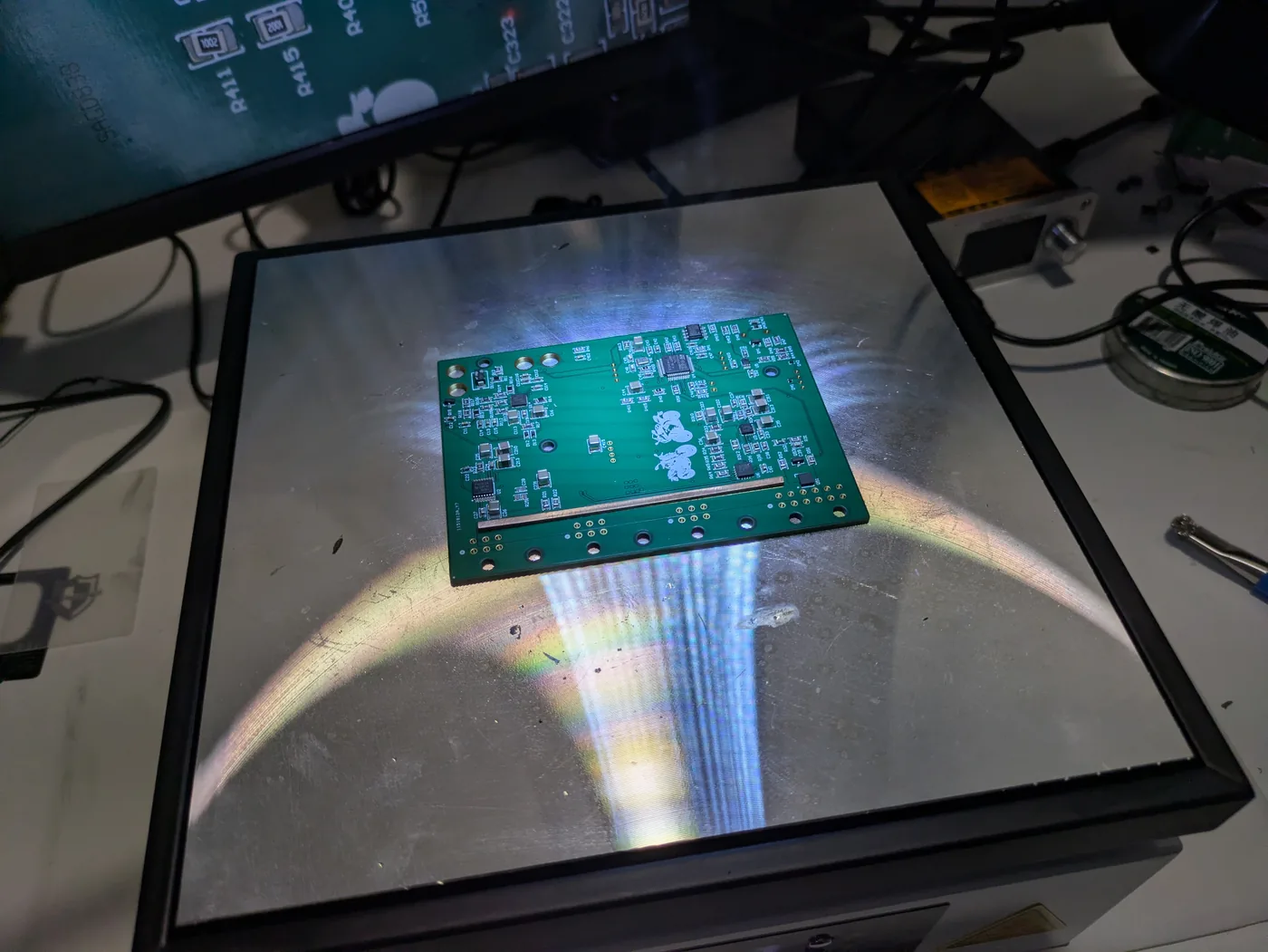 Custom power board placed on preheating station for reflow