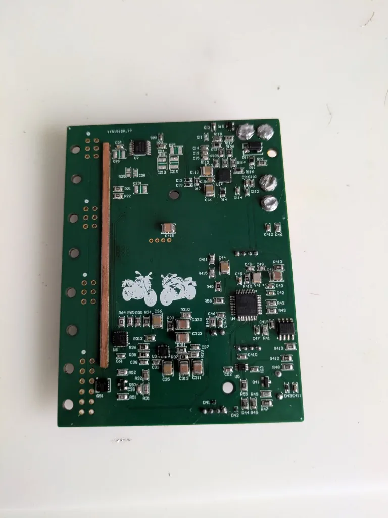 Custom PCB bottom layer showing MCU, sense routing & custom silkscreen artwork